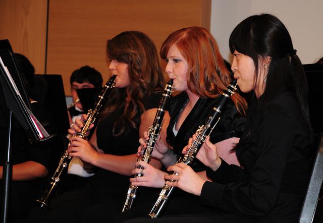 CU Concert Band members, from left, Gwanhee Park of Busan, Korea; Chasity Ballard of Bardstown, Ky.; and Jenna Embry of Leitchfield, Ky. play clarinet in a concert. (Campbellsville University Photo by Emily Campbell