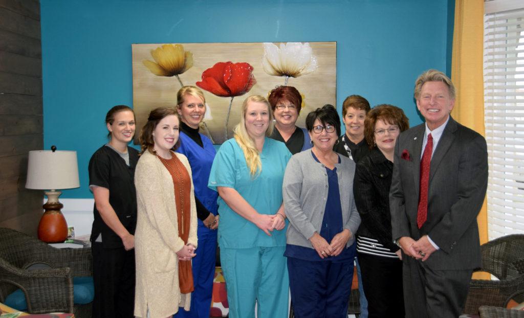 Dr. Holly Davis’ dental office is now playing 88.7 The Tiger WLCU FM music and especially likes the “Jess in the Morning” program. From left are: Front row -- Dr. G. Ted Taylor, vice president for university outreach, his wife, Sheri; Ellen Reynolds, Davis and Jesslyn McCandless. Back row -- Lallie Davis, Denise Bradshaw, Katina Gootee and Demi Toebbe. (Campbellsville University Photo by Ariel Emberton)